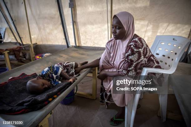 Aisha Mohammed and her two-year-old son, Umar, who is being treated for cholera is seen in Maiduguri, the capital of Borno State. Islamic militant...