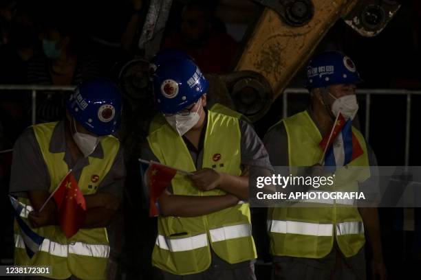 Chinese construction workers listen to a speech during the National Library's foundation stone ceremony on February 3, 2022 in San Salvador, El...