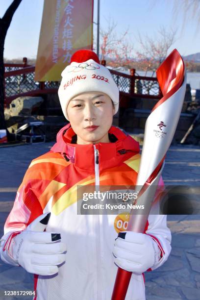 Ding Ning, the women's table tennis singles gold medalist at the 2016 Rio de Janeiro Olympics, takes part in the Beijing Winter Olympic torch relay...