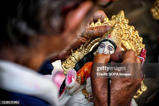 An artist makes final touches to an idol of Hindu Goddess Saraswati during the preparations for the festival. Basant Panchami or Vasant Panchami is a...