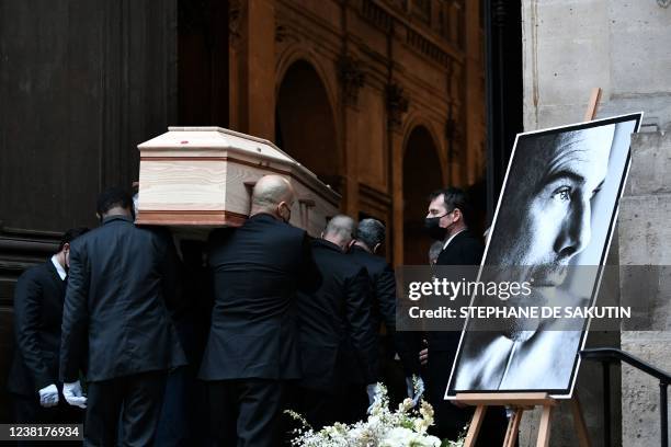 Pallbearers carry the coffin of late French designer Thierry Mugler into the protestant church of the Oratory of the Louvre in Paris on February 4...