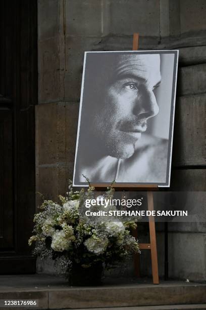 Photograph shows a black and white portrait of late French designer Thierry Mugler displayed at the entrance of the protestant church of the Oratory...