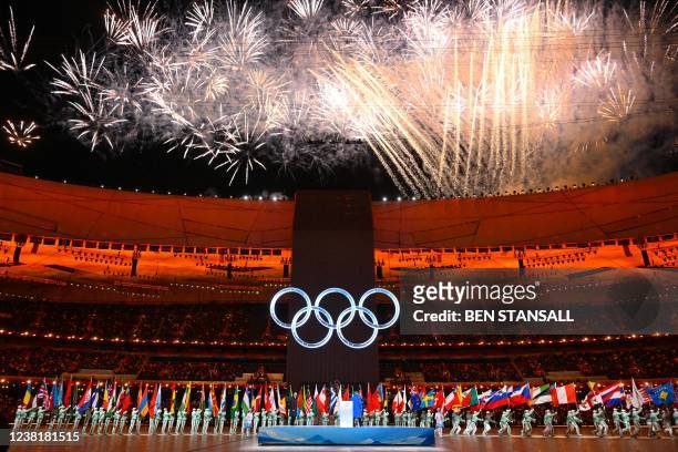 Fireworks explode over the Olympic rings during the opening ceremony of the Beijing 2022 Winter Olympic Games, at the National Stadium, known as the...