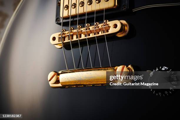 Detail of the stoptail bridge on a vintage 1989 35th Anniversary Gibson Les Paul Custom electric guitar, taken on October 1, 2020.