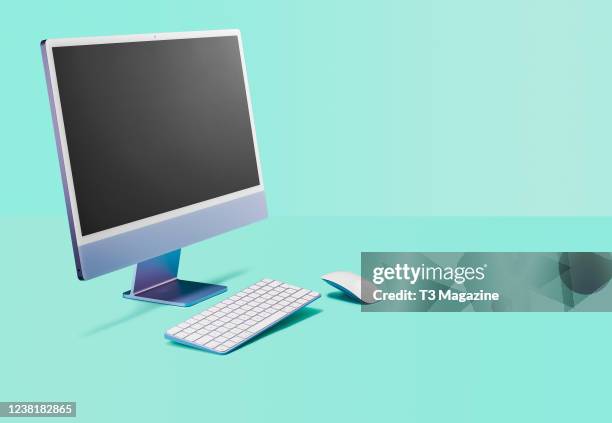 An Apple iMac M1 desktop computer with an Apple Magic keyboard and mouse, taken on May 14, 2021.