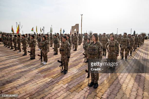Syrian Democratic Forces fighters take part in a funeral in Syria's northeastern city of Hasakeh on February 2022, for members of the group killed in...