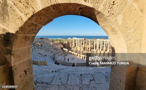 People visit the amphitheatre of the ancient Roman city of Leptis Magna, in the coastal Libyan city of Al-Khums, some 120Km east of the capital...