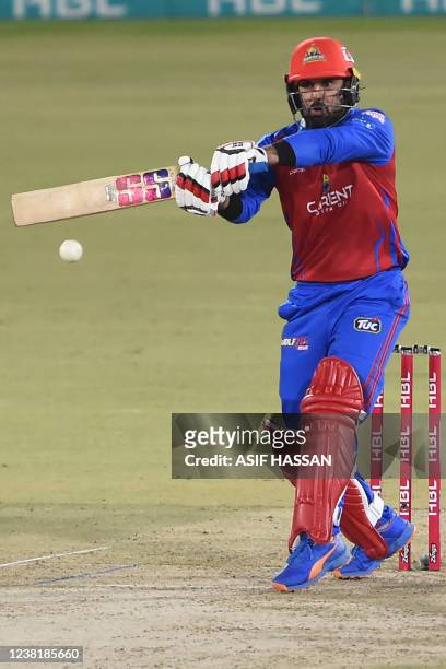 Karachi Kings' captain Babar Azam plays a shot during the Pakistan Super League Twenty20 cricket match between Karachi Kings and Peshawar Zalmi at...