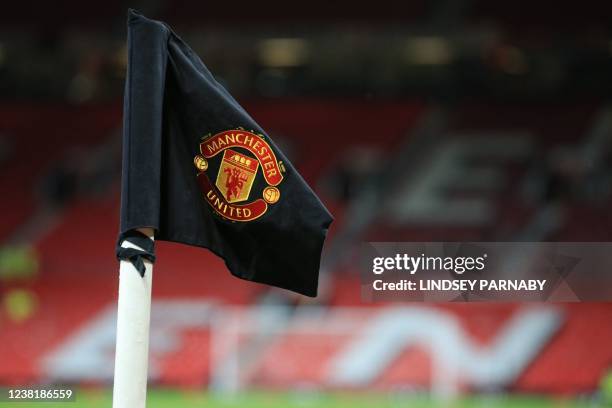 The club's crest is seen on a black corner flag, in commemoration of the Munich Air Disaster of February 1958, ahead of the English FA Cup fourth...