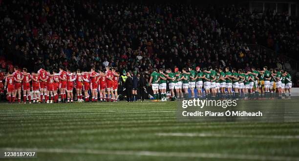 Cork , Ireland - 4 February 2022; Players stand during a minutes silence in memory the late Tom Kiernan, former Munster and Ireland rugby player,...