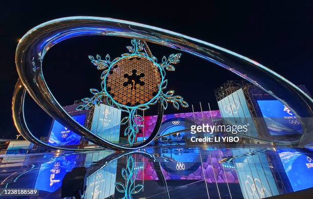 The Olympic cauldron outside the National Stadium, known as the Bird's Nest, in Beijing, is seen with the National Aquatics Centre in the background,...