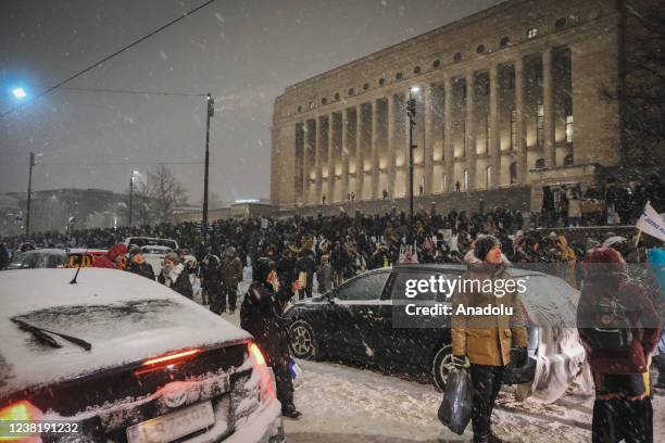 Around 700 people and some tens of vehicles gather to protest in front of the Finnish Parliament against the Covid-19 restrictions put in place by...