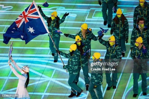 Flag bearers Brendan Kerry and Laura Peel of Team Australia carry their flag during the Opening Ceremony of the Beijing 2022 Winter Olympics at the...