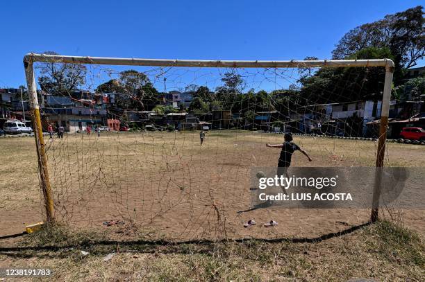 Children play football in El Erizo neighbourhood, in the province of Alajuela, Costa Rica, on January 4, 2022. - Costa Rica, one of the most stable...