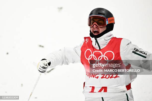 Australia's Cooper Woods-Topalovic reacts after his run in the freestyle skiing men's moguls final during the Beijing 2022 Winter Olympic Games at...