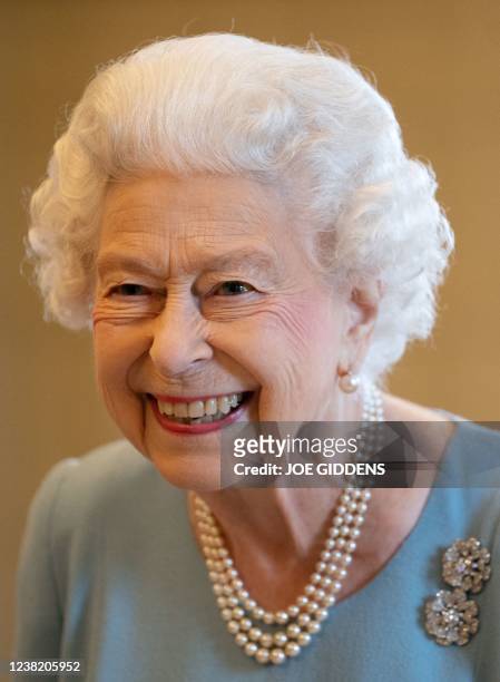 Britain's Queen Elizabeth II smiles during a reception in the Ballroom of Sandringham House, the Queen's Norfolk residence on February 5 as she...