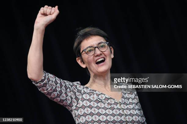 French far-left Lutte ouvriere party's leader and presidential candidate Nathalie Arthaud sings left-wing anthem "The International" at the end of a...