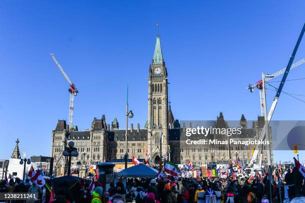 People gather around Parliament Hill in support of the Freedom Convoy truck protest on February 5, 2022 in Ottawa, Canada. Truckers continue their...