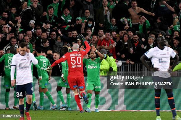 Saint-Etienne's players celebrate after scoring during the French L1 football match between AS Saint-Etienne and Montpellier Herault SC at the...