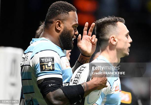 Racing's French outside centre Virimi Vakatawa celebrates after scoring a try during the French Top 14 rugby union match between Racing 92 and Brive...