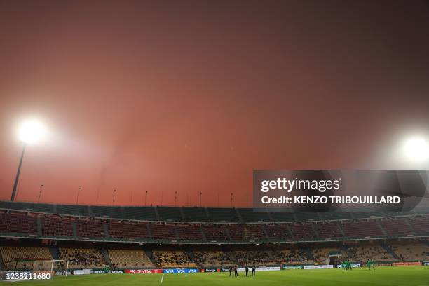 General view shows a red sky over the stadium before the Africa Cup of Nations 2021 third place football match between Burkina Faso and Cameroon at...