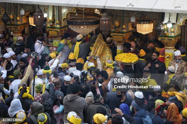 Devotees offer prayers at Nizamuddin Dargah on the occasion of Basant Panchami, on February 5, 2022 in New Delhi, India.