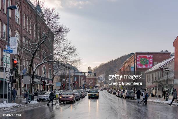 Vehicles and pedestrians on Main Street in Montpelier, Vermont, U.S., on Wednesday, Dec. 22, 2021. In January 2021, Montpelier, a state capital of...