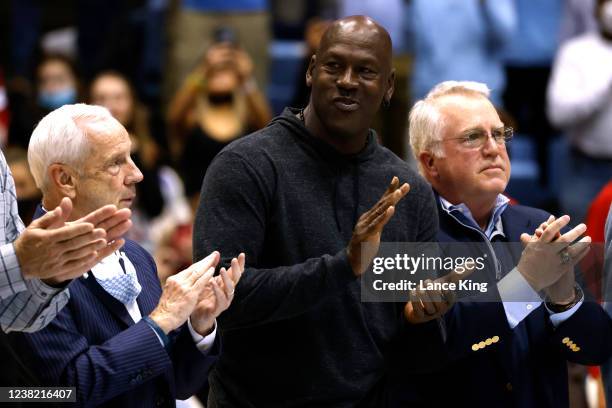 Former North Carolina Tar Heels coach Roy Williams and former player Michael Jordan are honored along with the 1982 championship team during the game...