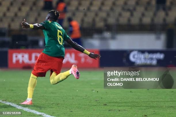 Cameroon's defender Ambroise Oyongo celebrates their victory after the penalty shoot-out at the end of the Africa Cup of Nations 2021 third place...