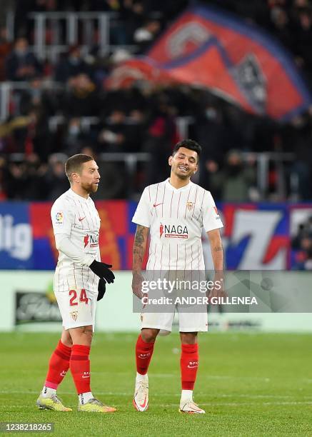 Sevilla's Argentinian forward Papu Gomez and Sevilla's Sevilla's Mexican forward Jesus Manuel Corona aka Tecatito react at the end of the Spanish...