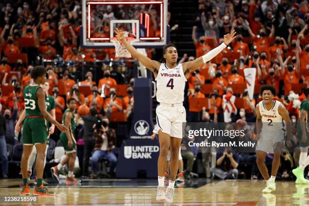 Armaan Franklin of the Virginia Cavaliers celebrates a three-point shot to end the first half during a game against the Miami Hurricanes at John Paul...