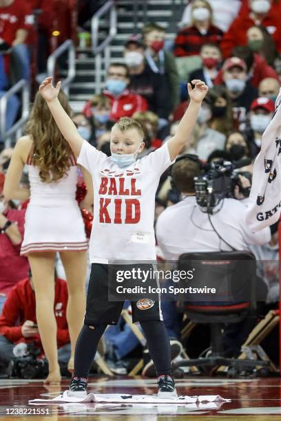 Ball Kid dances to the YMCA song during a college basketball game between the University of Wisconsin Badgers and the Penn State University Nittany...