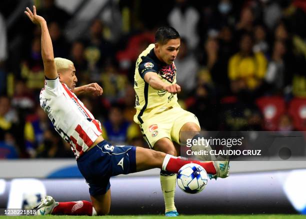 Salvador Reyes of America vies for the ball with Ricardo Chavez of San Luis during their Mexican Clausura 2022 tournament football match at the...