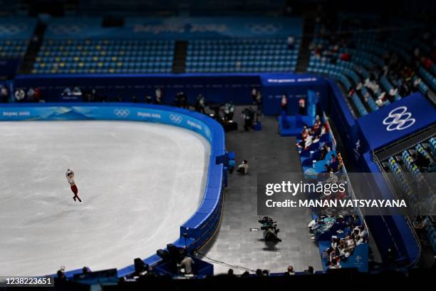 This picture taken with a tilt and shift lens shows Russia's Mark Kondratiuk competing in the men's single skating free skating of the figure skating...