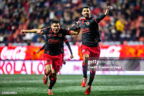 David Barbona and Lisandro Lopez of Tijuana celebrate their team's first goal during the 4th round match between Club Tijuana and Pumas UNAM as part...