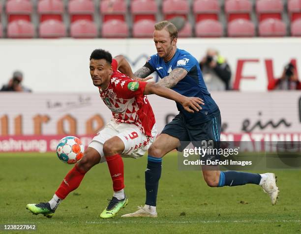 Karim Onisiwoof 1. FSV Mainz 05, Kevin Vogt of TSG Hoffenheim during the Bundesliga match between 1. FSV Mainz 05 and TSG Hoffenheim at MEWA Arena on...