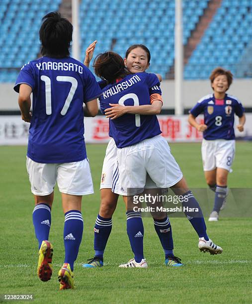 Nahomi Kawasumi of Japan celebrates the first goal with Homare Sawa during the London Olympic Women's Football Asian Qualifier match between Japan...