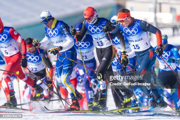 Calle Halfvarsson of Sweden, Friedrich Moch of Germany, Andrew Musgrave of Great Britain in action competes during the Cross-Country Skiing Mens...