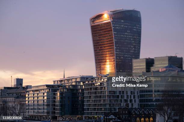 City of London skyline with 20 Fenchurch Street, affectionately nicknamed the Walkie Talkie reflecting the sun going down on 2nd February 2022 in...