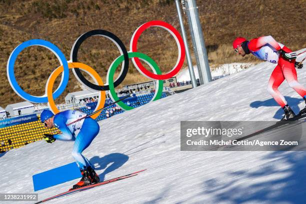 Andrew Musgrave of Team Great Britain competes, Jonas Baumann of Team Switzerland competes during the Olympic Games 2022, Men's Cross Country...