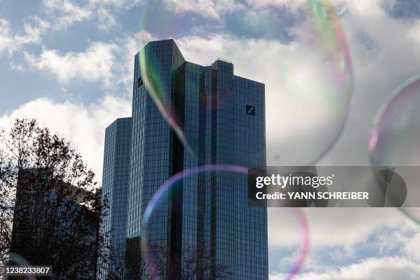 Soap bubbles are pictured in front of the headquarter of Deutsche Bank in Frankfurt am Main, western Germany, on February 5, 2022.