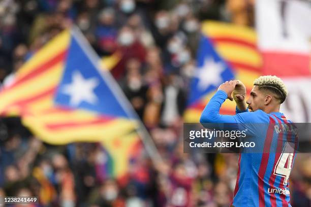 Barcelona's Uruguayan defender Ronald Araujo celebrates after scoring a goal during the Spanish league football match between FC Barcelona and Club...