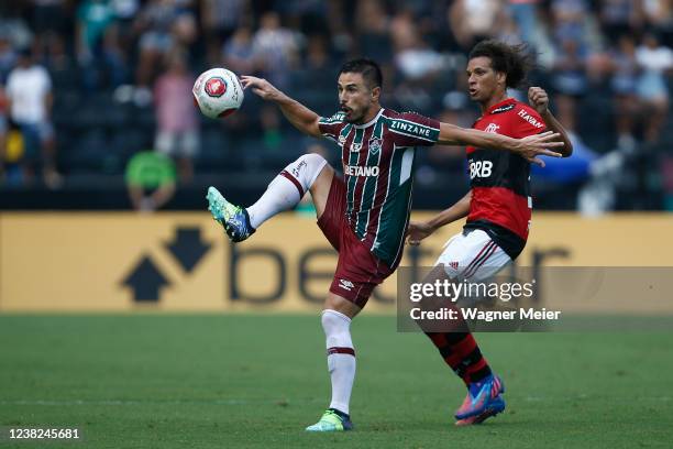 William Area of Flamengo competes for the ball with William Bigode of Fluminense during a match between Flamengo and Fluminense as part of the Taca...