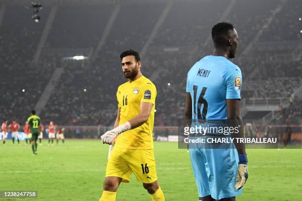 Egypt's goalkeeper Mohamed Abogabal and Senegal's goalkeeper Edouard Mendy attend a penalty shoot-out as part of the Africa Cup of Nations 2021 final...