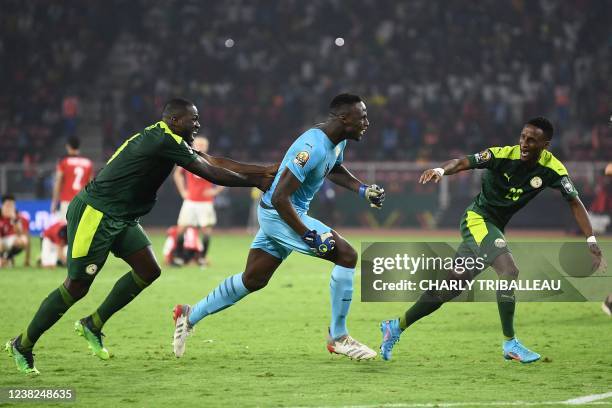 Senegal's goalkeeper Edouard Mendy celebrates with teammates after winning the Africa Cup of Nations 2021 final football match between Senegal and...