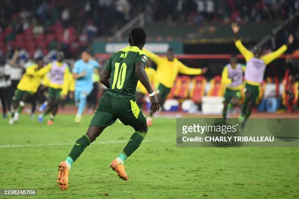 Senegal's forward Sadio Mane celebrates after scoring the last shot of the penalty shoot-out during the Africa Cup of Nations 2021 final football...
