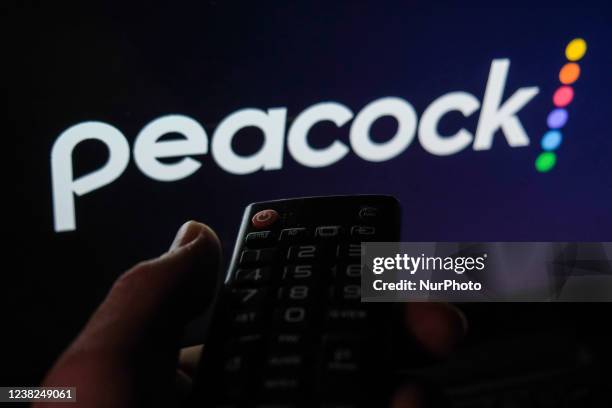 Remote control is seen with Peacock logo displayed on a screen in this illustration photo taken in Krakow, Poland on February 6, 2022.