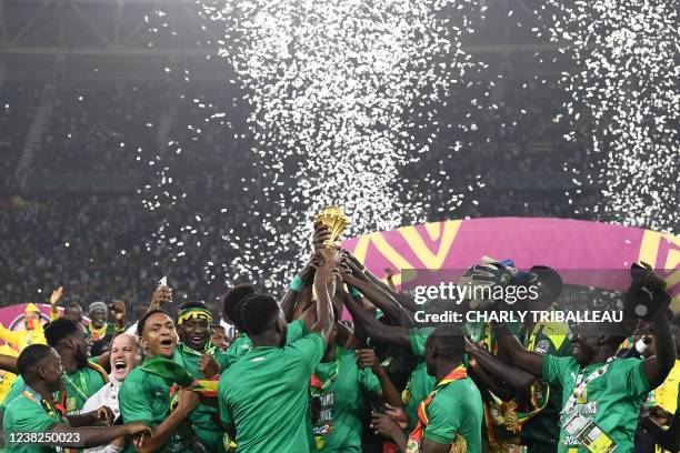 Senegal's players celebrate with the trophy after winning the Africa Cup of Nations 2021 final football match between Senegal and Egypt at Stade...