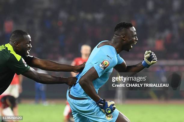 Senegal's goalkeeper Edouard Mendy celebrates after winning after the penalty shoot-out as part of the Africa Cup of Nations 2021 final football...