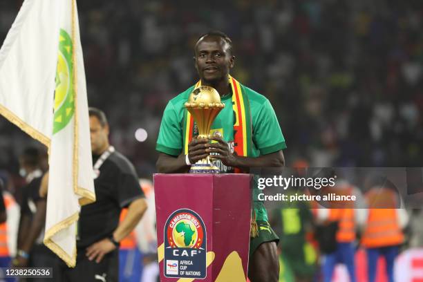 February 2022, Cameroon, Yaounde: Senegal's Sadio Mane poses with the trophy after his team's victory in the 2021 Africa Cup of Nations final soccer...